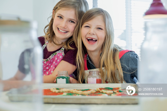 Portrait of girls decorating cookies