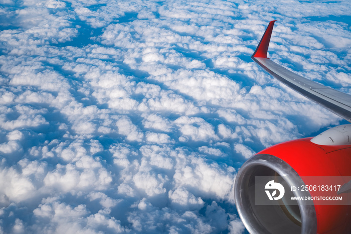 View of clouds and wing from a plane window