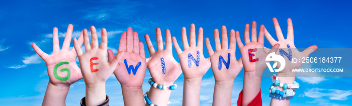 Children Hands Building Colorful German Word Gewinnen Means Win. Blue Sky As Background