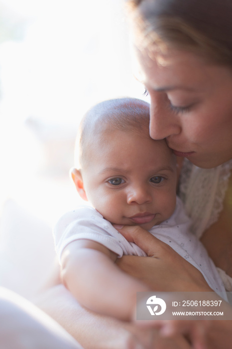 Mother holding cute baby son