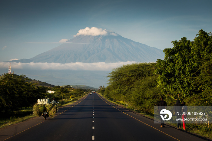 A road with Mount Meru in background, Tanzania.