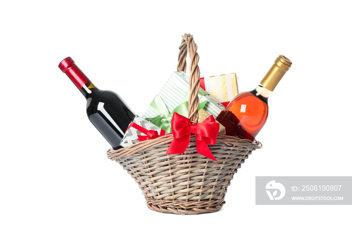 Wicker basket with bottles of wine and presents isolated on white background