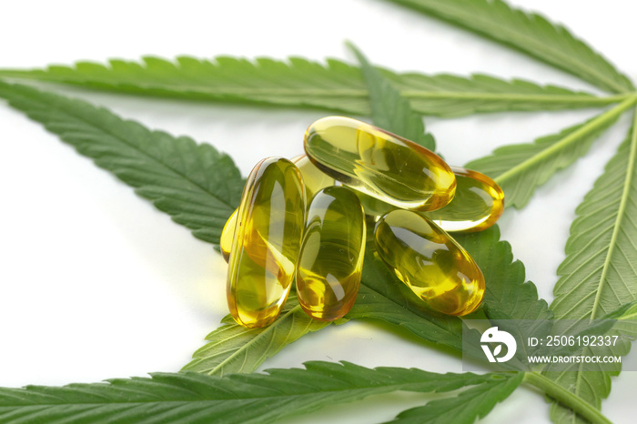 Cannabis essential oil Capsules on white background.