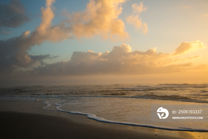 Sunrise with foam and waves  at Fernandina Beach on Amelia Island, Florida.