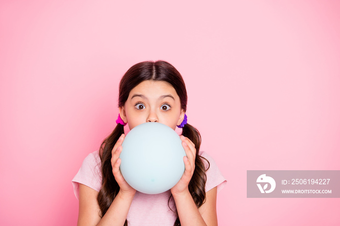 Close up photo of charming kid holding white baloon inflate wearing t-shirt isolated over pink backg