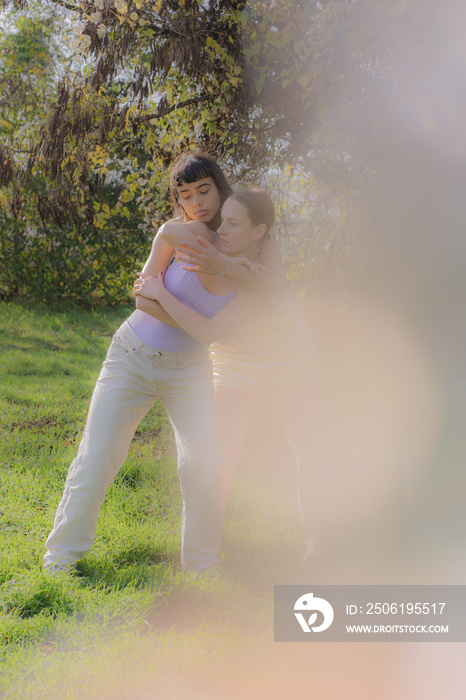 women in nature dancing