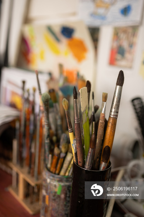 Close up of different brushes for painting standing on the table