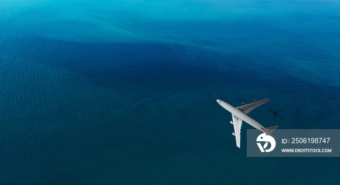 Aerial top view of Airplane flies over a sea, view from above