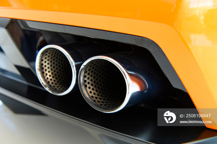 Exhaust pipe of yellow sport car