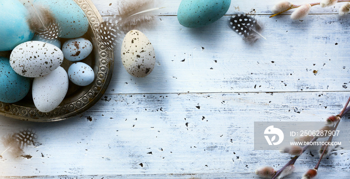 Easter background with Easter eggs on white table