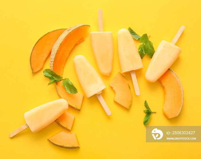 Tasty melon popsicles on color background