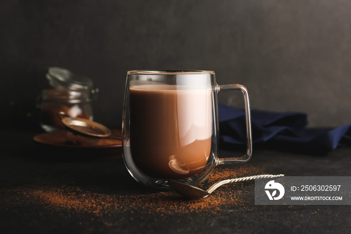 Glass cup of tasty cocoa drink on table