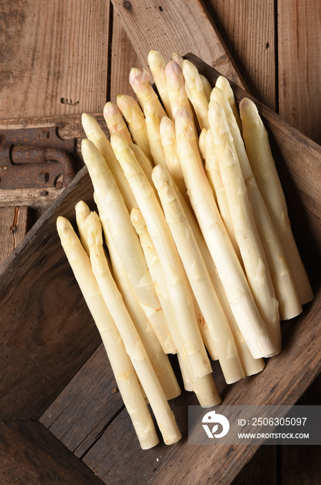 white asparagus on old table