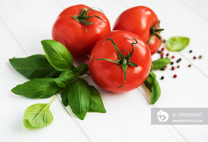 Fresh tomatoes with green basil