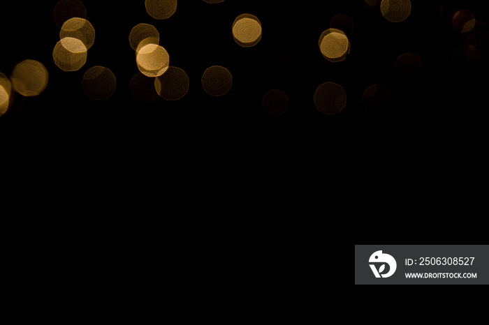 Abstract gold bokeh with black background