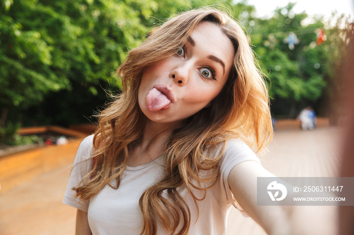 Close up of a funny young girl taking selfie