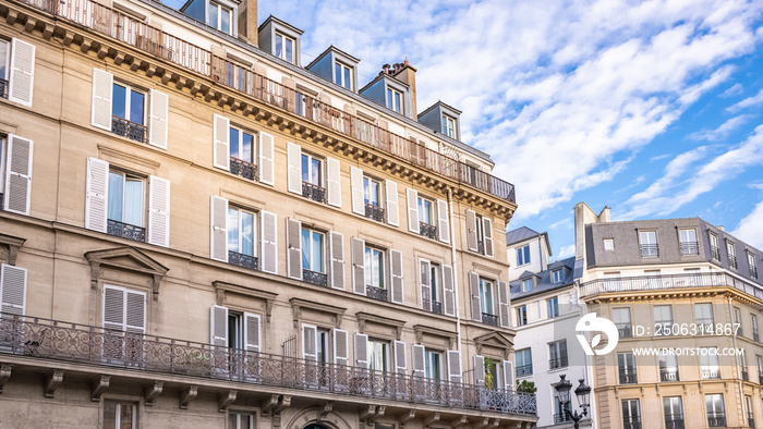 Paris, typical facade and windows, beautiful buildings in the Marais