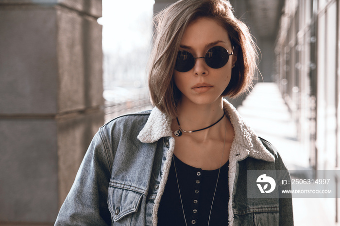 Beautiful and stylish girl in sunglasses on a sunny day