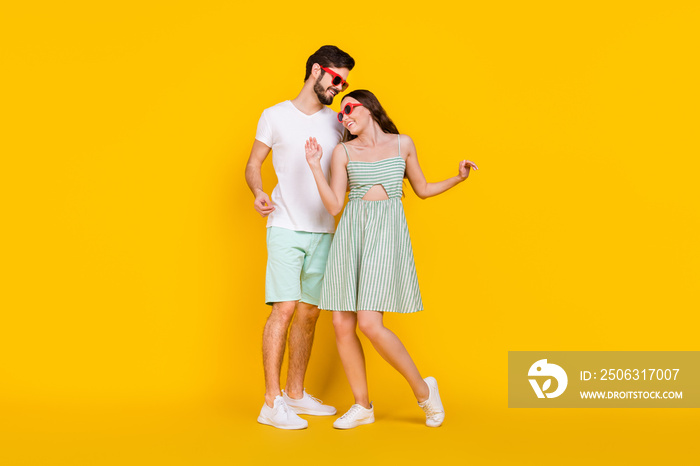 Photo of carefree traveler couple enjoy party dance cuddle wear casual outfit isolated yellow color 