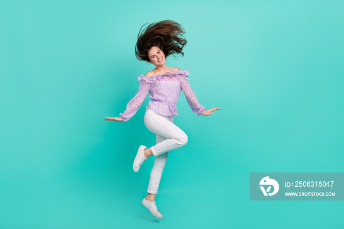 Full size photo of pretty adorable girl flying hair good mood free time isolated on turquoise color 