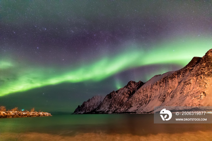 Northern Lights over the Ersfjord Beach. Senja island at night, Norway. Europe