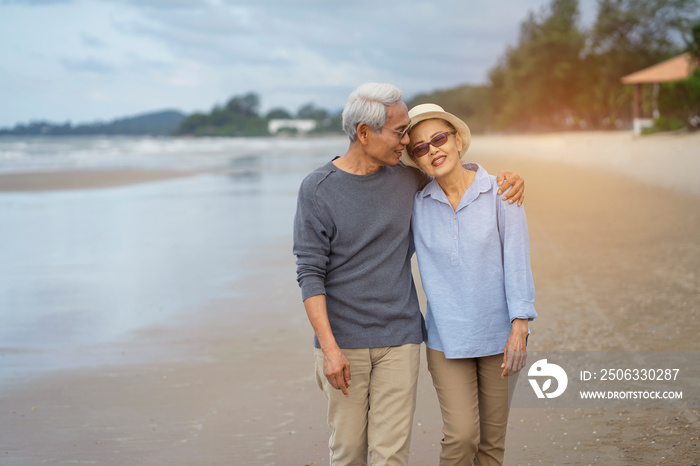 Asian couple senior elder retire resting relax walking running at the beach.Honeymoon family togethe