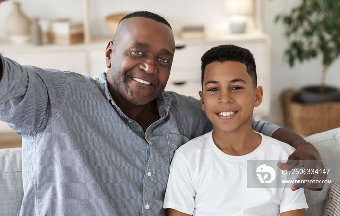 Selfie With Grandfather. Happy black granddad and grandson taking photo together