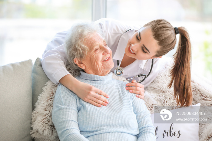 Doctor with senior woman in nursing home