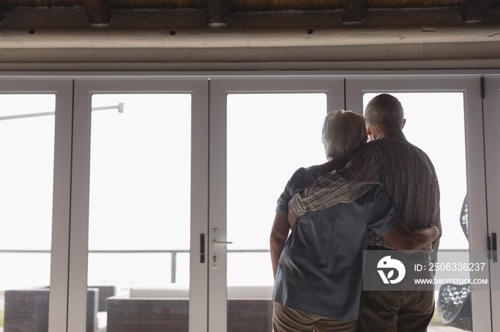 Senior couple standing together at home