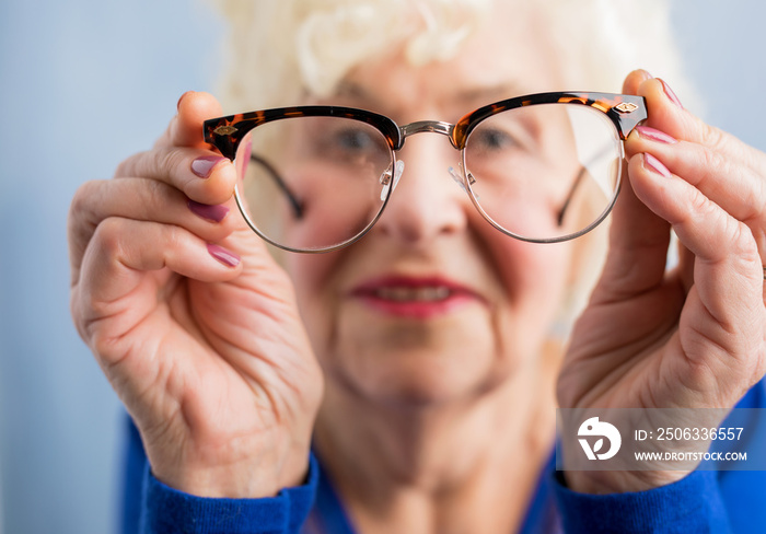 Grandma looking through her glasses