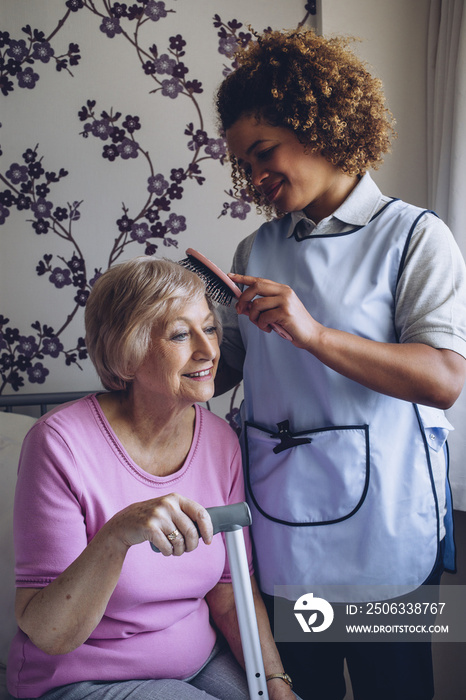 Carer Brushing Patients Hair