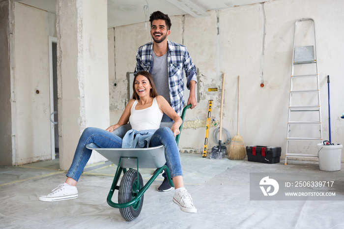 Loving couple is having fun while they are renovating house