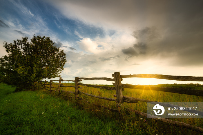 Fence on a sunny pasture