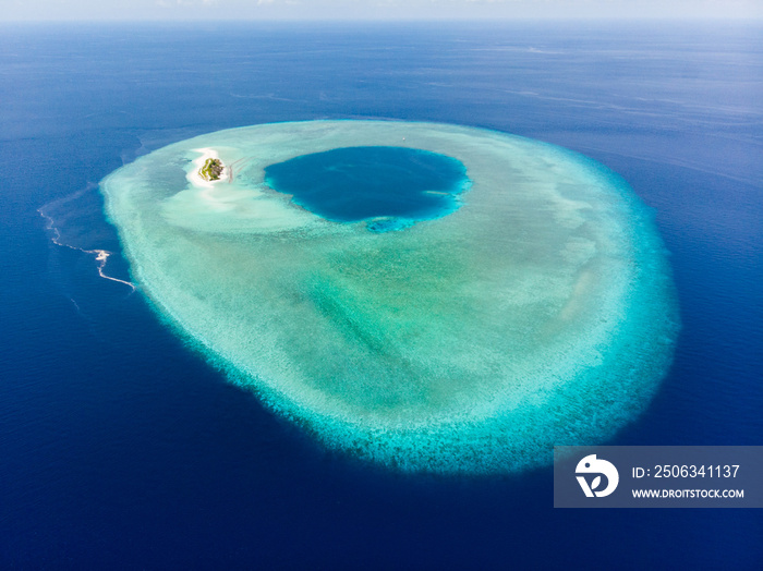 Aerial idyllic atoll, scenic travel destination Maldives Polinesia. Blue lagoon and turquoise coral 