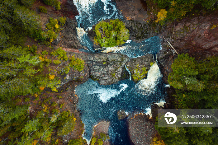 Incredible look down travel aerial photograph of Saxon Falls waterfall, cascades and whitewater rapi