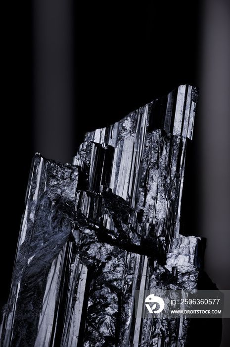 Schorl black tourmaline specimen close-up macro detail semi-precious gemstone texture dark backgroun