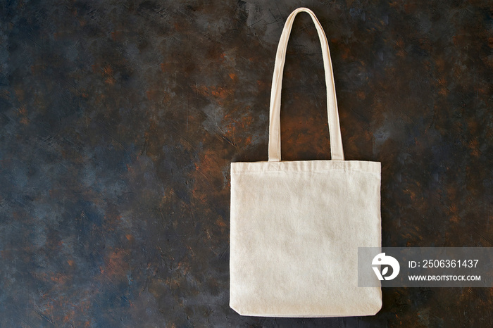 Blank cotton eco tote bag, design mockup. Eco-friendly bag on a black background.