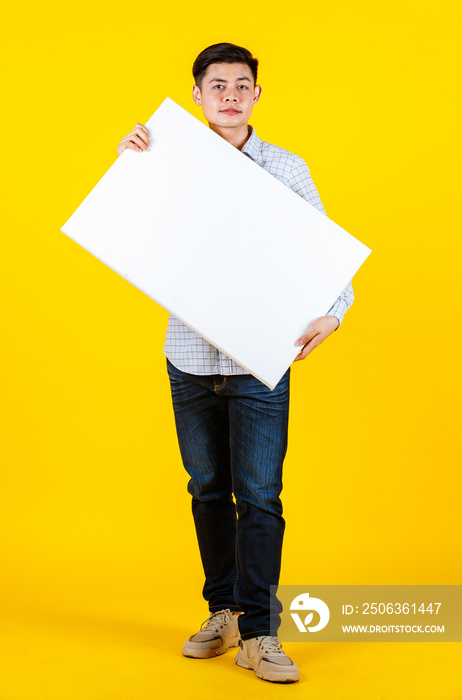 Portrait studio shot of Asian young handsome male businessman model in casual outfit standing smilin