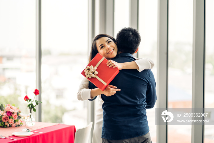 Romantic sweet couple having fun and smiling while celebrating enjoying valentines day time together