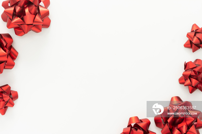 Red ribbon bows over white background. Birthday, Christmas or Valentines day mock up frame or borde