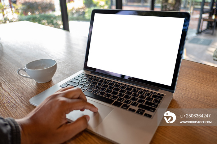 mock up Using laptop with blank screen computer modern Workspace in coffee shop