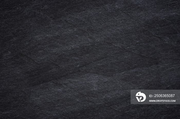 Dark grey black slate background or natural stone texture.