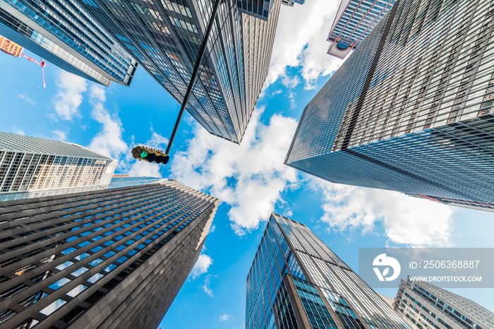 Skyscrapers in a finance district at Manhattan. New York, USA. Perspective view of modern skyscraper