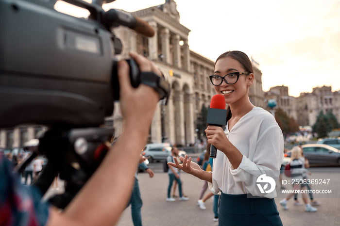 News that works. TV reporter presenting the news outdoors. Journalism industry, live streaming conce