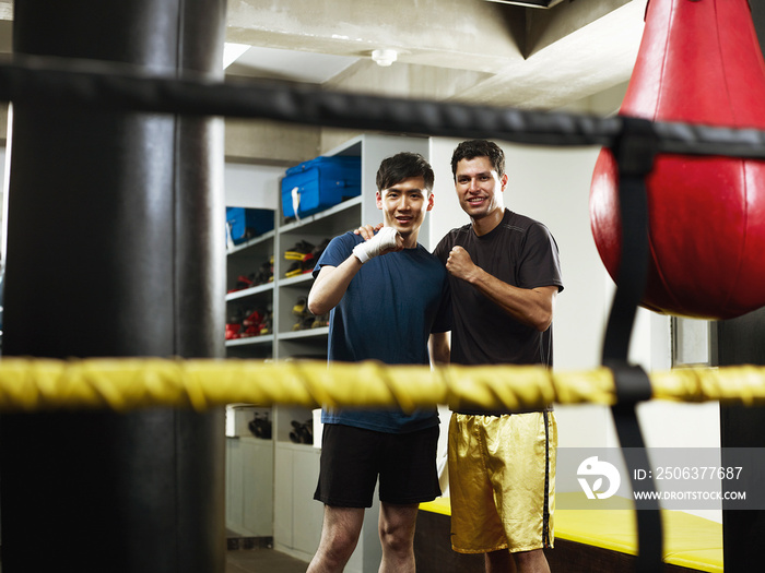 Boxers in changing room with clenched fists