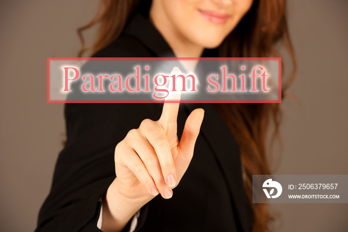 Attractive business woman pressing a virtual button paradigm shift