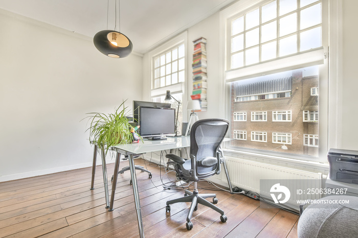 A cozy and spacious office room in a luxury design