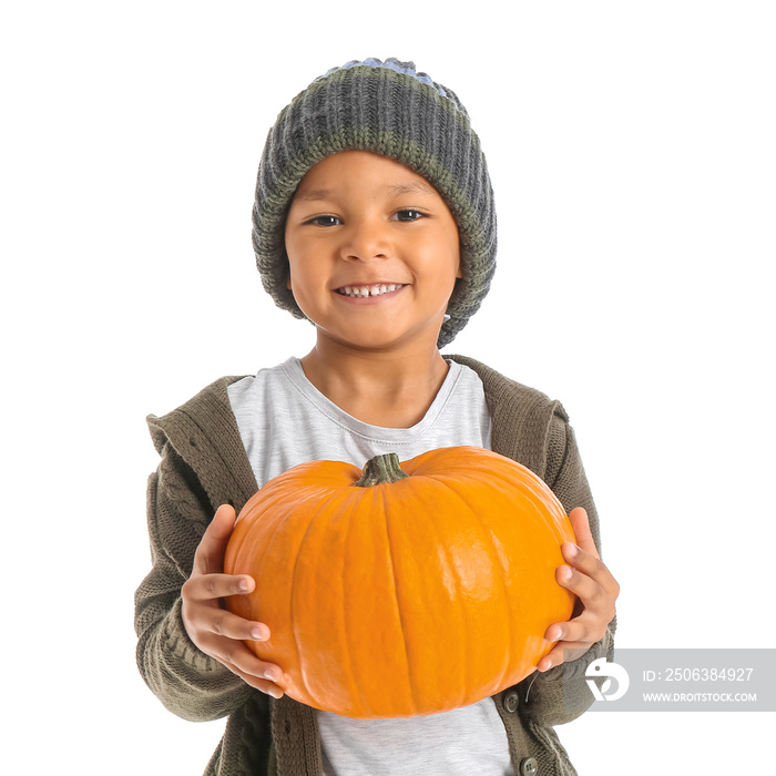 Cute African-American boy with pumpkin on white background