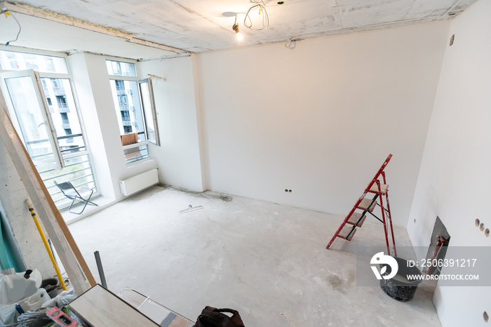 Interior of apartment with materials during on the renovation and construction, remodel wall from gy