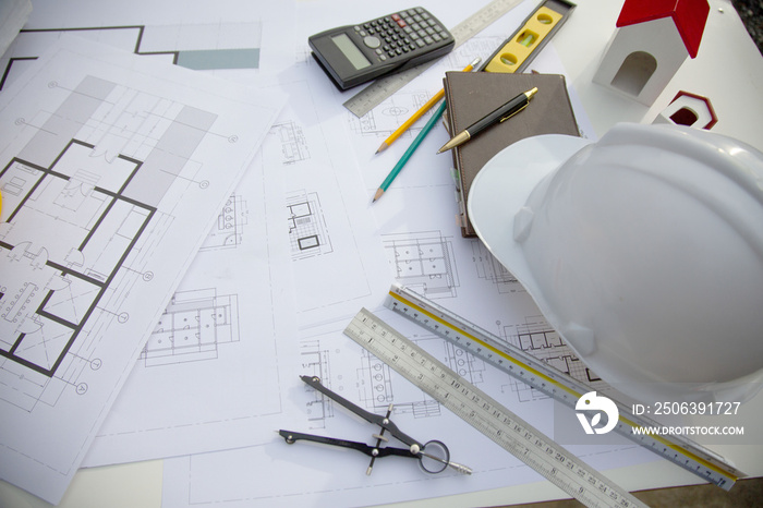 Desk of Architectural working project in construction site,With drawing equipment concept